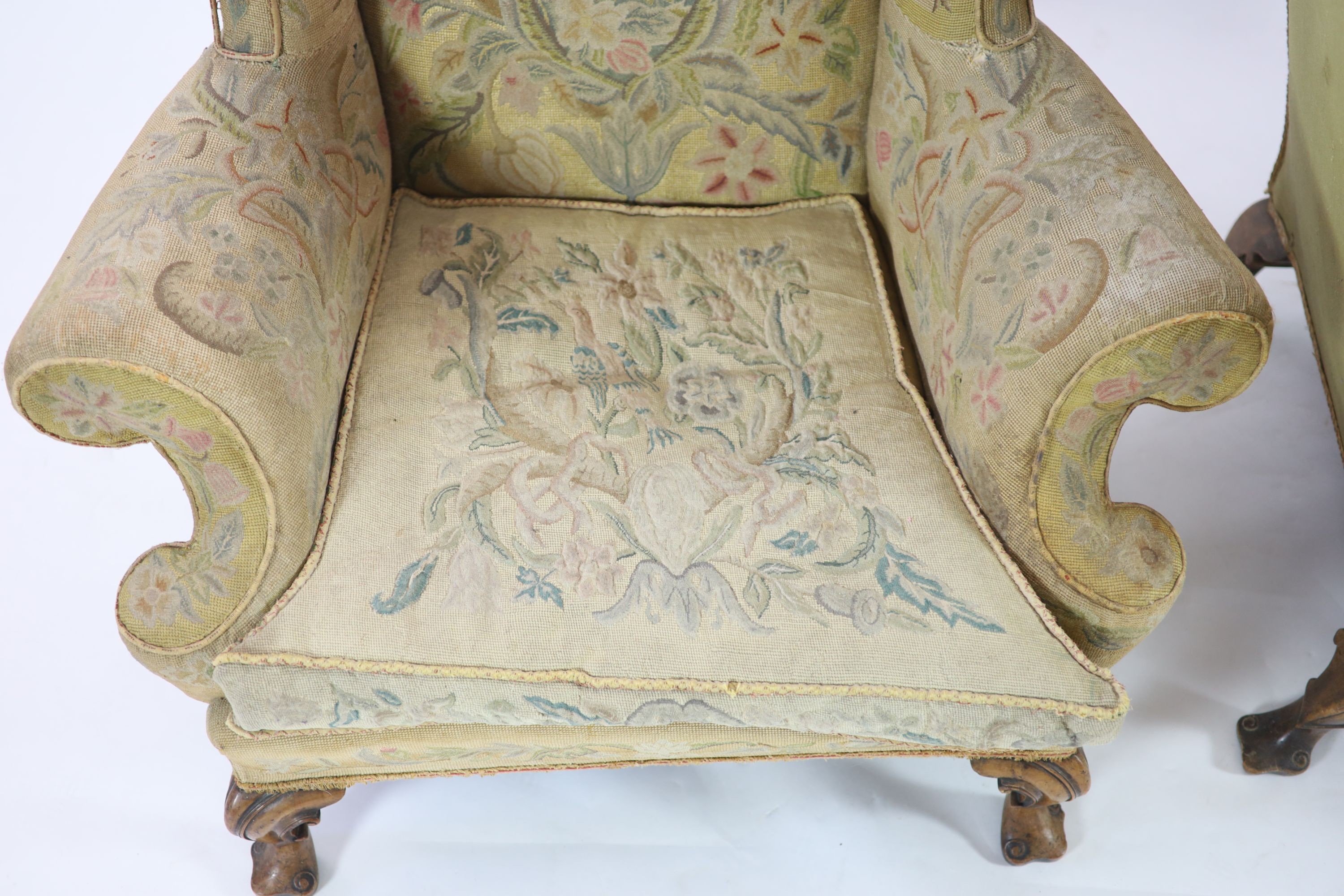 A pair of Georgian style mahogany wing armchairs W.104cm D.96cm H.120cm